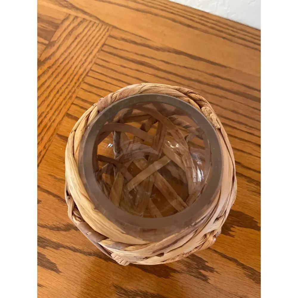Straw covered glass vase